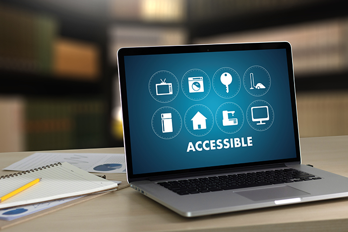 Stock imageof a lap top with the text "ACCESSIBLE" on the screen