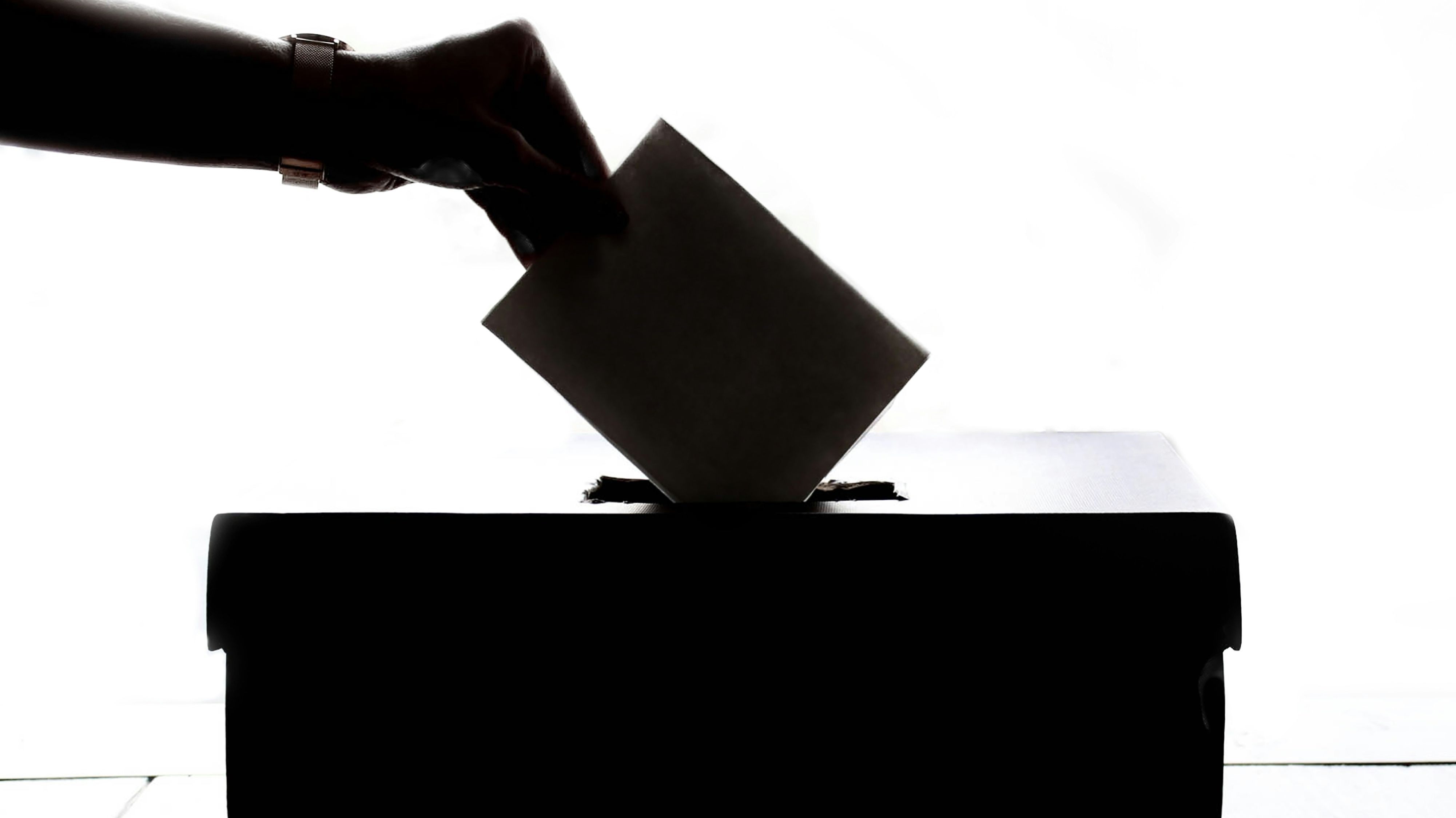 An election ballot as a vote is being cast.