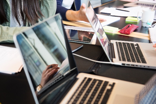 Photo of laptops in a working environment.