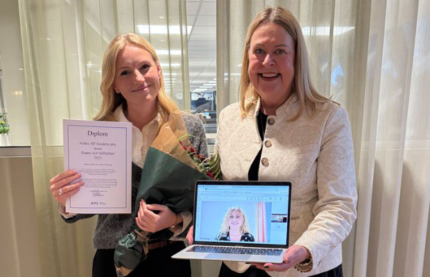 Female student with diploma and prize giver with laptop in hand with student online